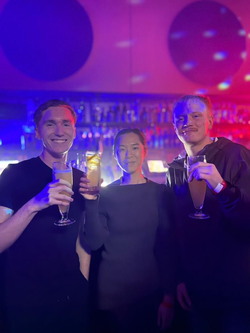 Guests raising drinks together